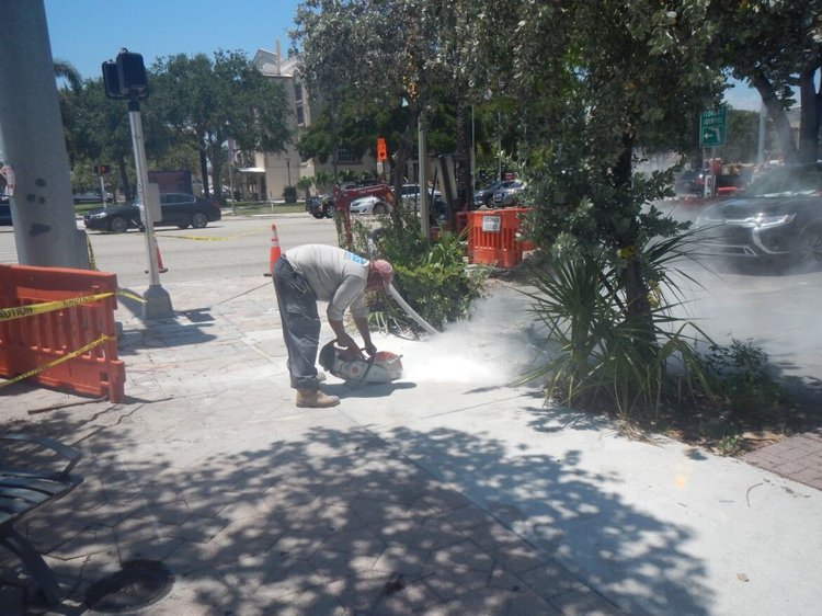 Saw cutting the sidewalk   May 2024