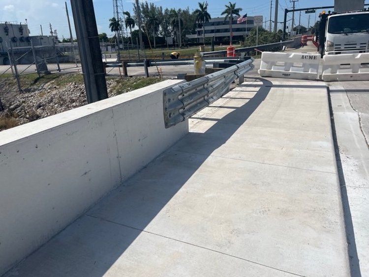 New sidewalk barrier wall and guardrail installed   July 2025