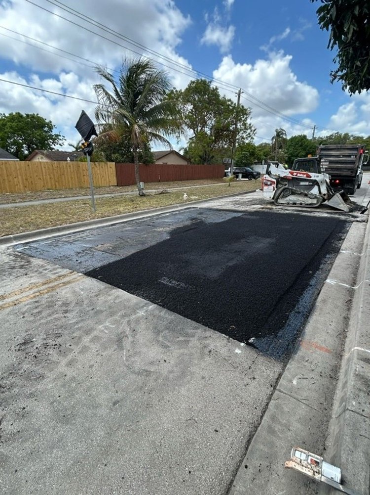 Speed table being paved along SW 11th St   May 2025