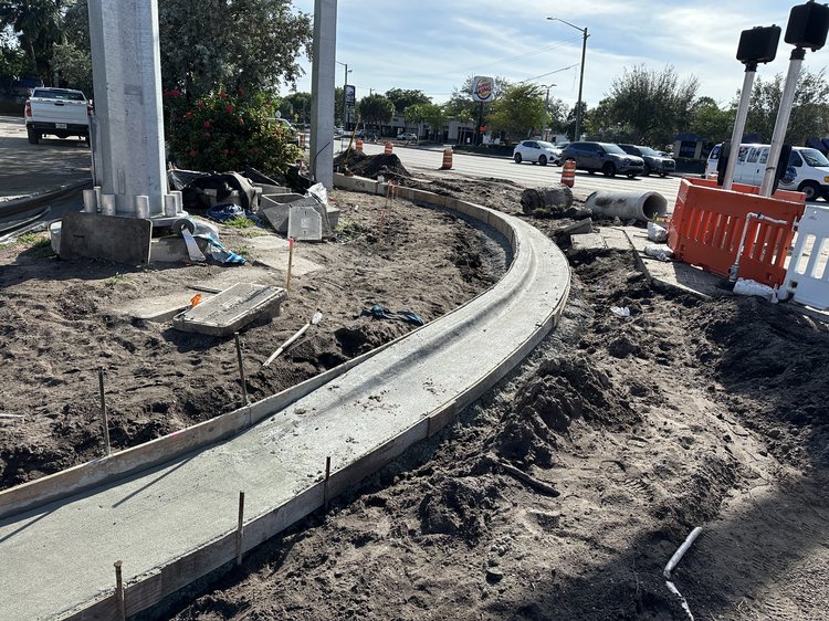 New curb and gutter on the Northeast corner of Forest Hill Blvd. and Military Trail.   December 2024