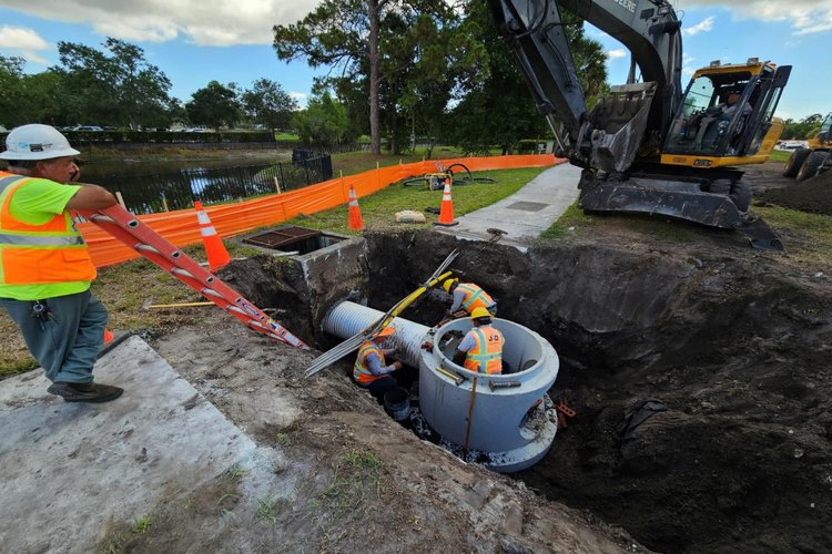 Installing pipe from existing inlet to S 21B, north side looking east, June 2024