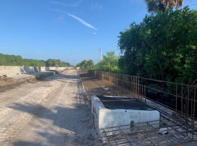 Rebar tied in place for slipform concrete barrier wall and junction coping slab.  Located at left roadway on NB & WB SR 710 Warfield Blvd at SW Tommy Clements Street, August. 2024