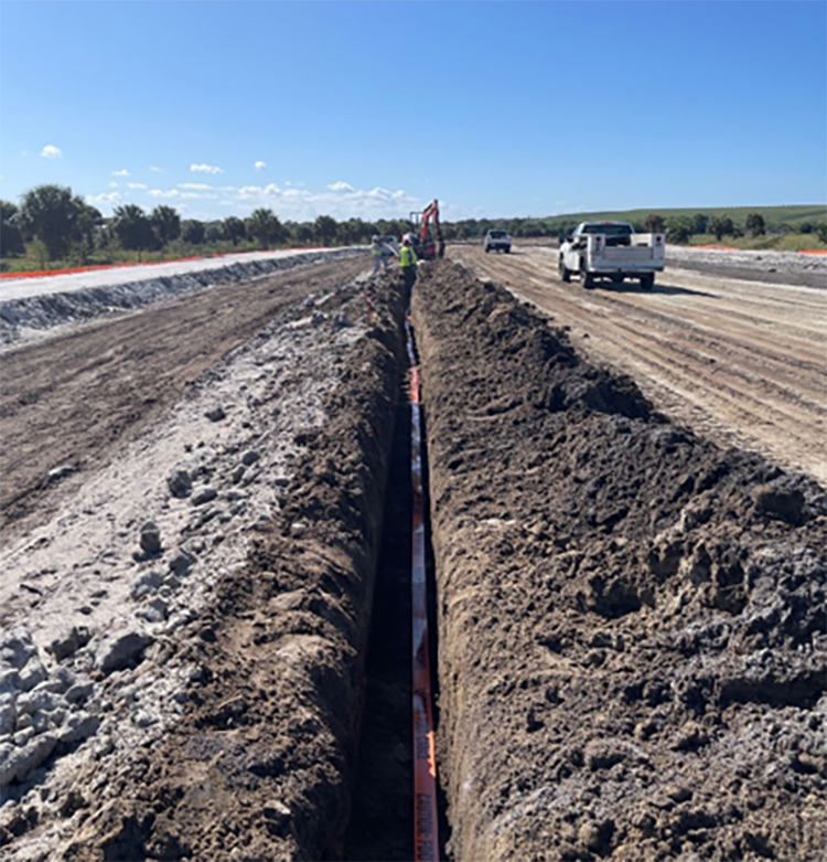 Installing ITS conduits along new 82nd Avenue Alignment, Mar. 2024