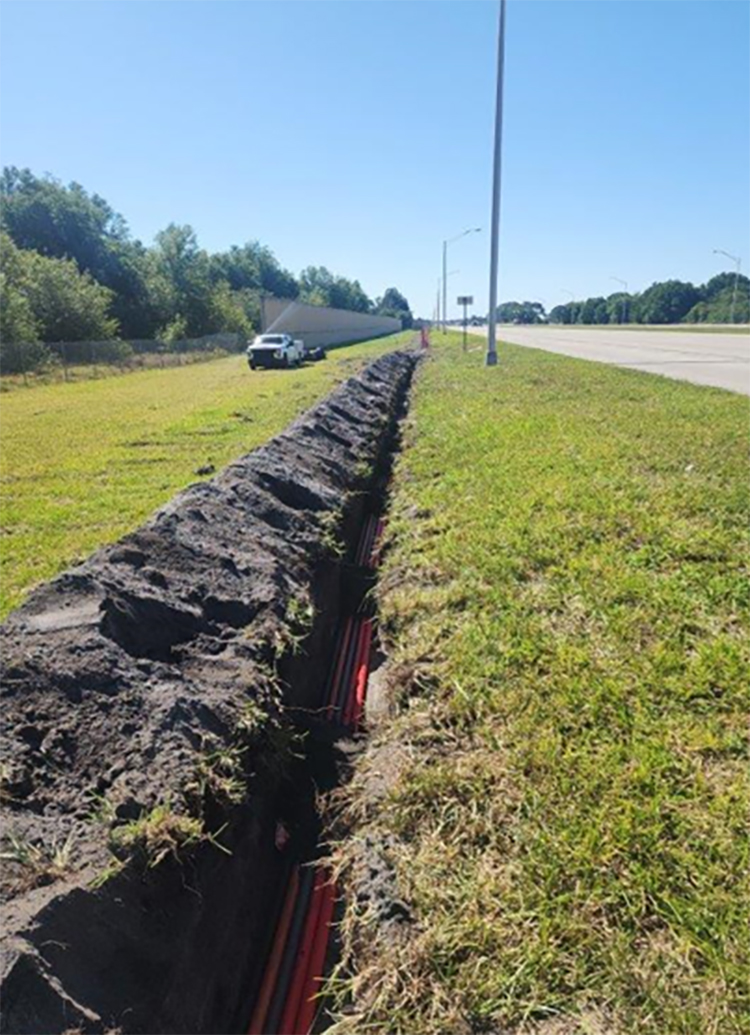 Installing ITS conduits along northbound I 95, north of Oslo Road, Apr. 2024